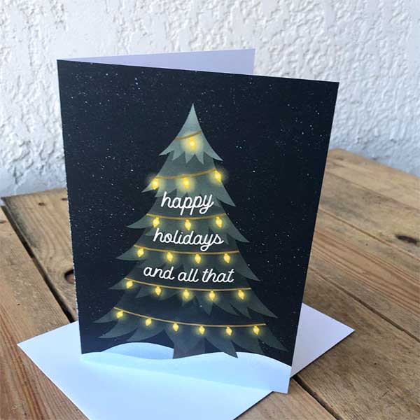 Happy holiday cards with white envelopes