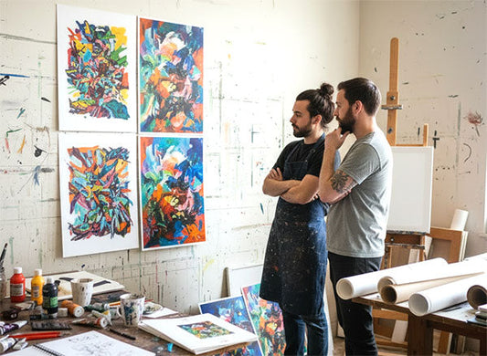 Artists reviewing prints