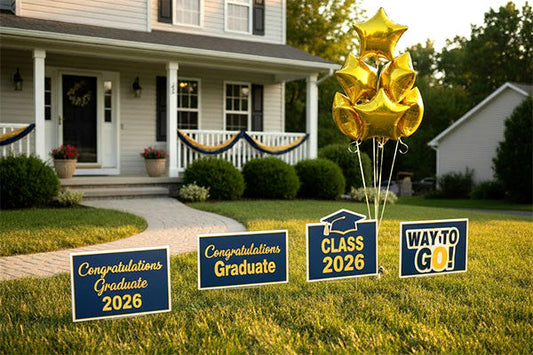 Home with graduation yard signs