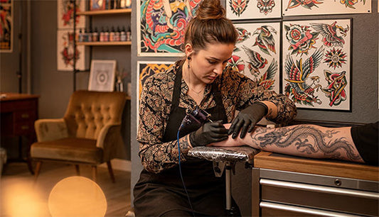 Tattoo artist working