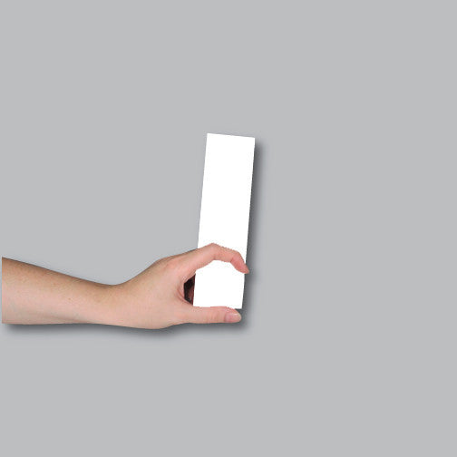 Demonstrating the size of a 2x7 bookmark or ticket