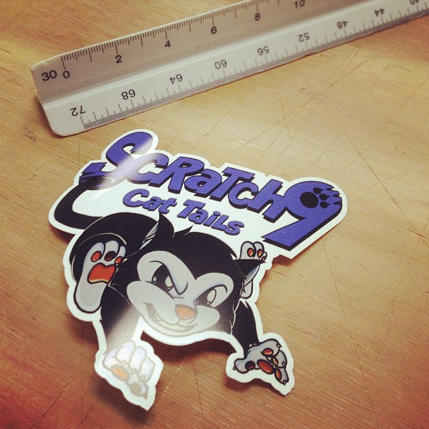 1 die cut sticker next to a ruler